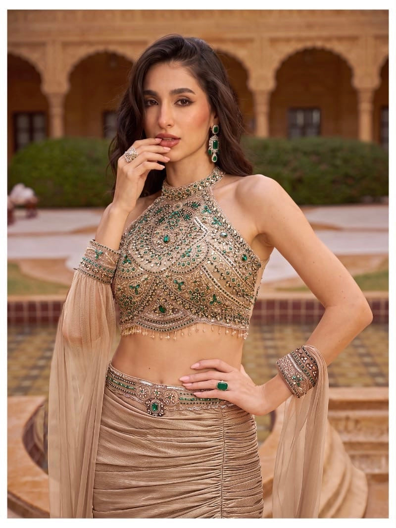 Mocha Gold Mermaid Lehenga Set with Emerald Embellished Halter Blouse & Sheer Cape